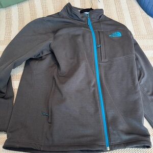 The North Face Men's Dark Gray Jacket with Blue Accents